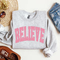 Believe Varsity Collegiate Christmas Santa Winter Xmas Festive Holiday Cheer Sweatshirt