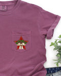 Christmas Star Pocket With Pine Cones And Ribbon Winter Snow Santa Scene Comfort Colors Tee