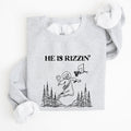 He Is Rizzin Basketball Jesus Easter Humorous Hoop Faithful Inspirational Quote Sweatshirt