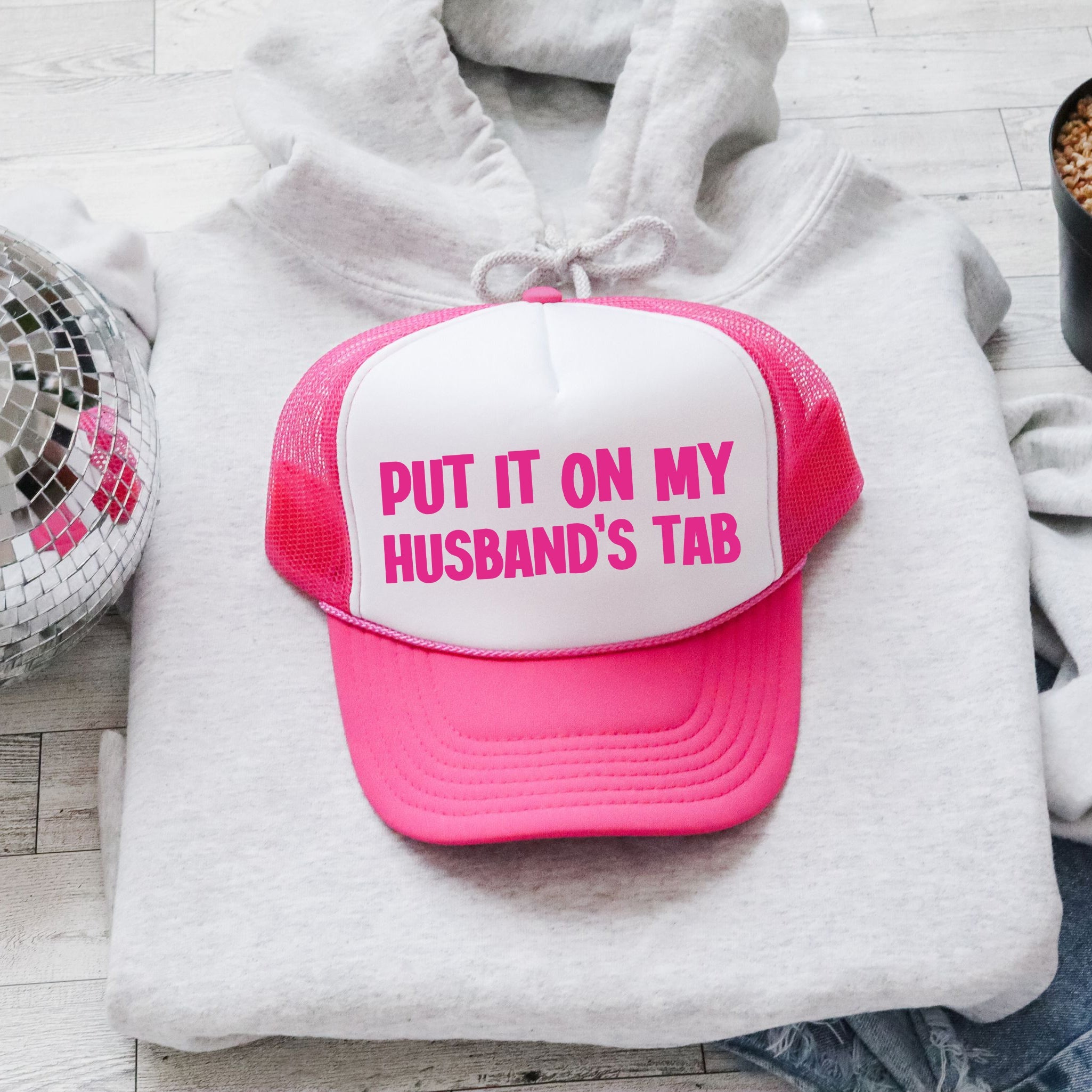 Put It On My Husband's Tab Sassy Saying Graphic Trucker Hat For Bold Style Casual