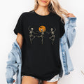 Skeleton Dancers Halloween Themed Spooky Dance Illustration With Playful Grinning Skulls Graphic Tee